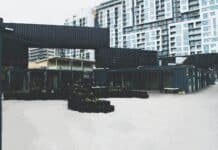 black concrete building near high-rise buildings