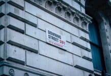 a street sign on the side of a building