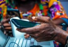 shallow focus photo of person holding black Android smartphone