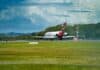 a large jetliner taking off from an airport runway