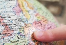 person holding white and blue map