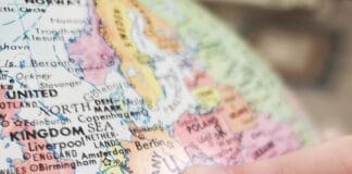 person holding white and blue map