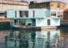 white wooden house near body of water at daytime