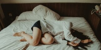 woman lying on bed