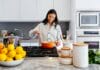 woman cooking inside kitchen room