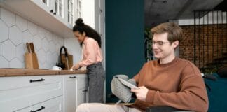 A man in a wheel chair in a kitchen