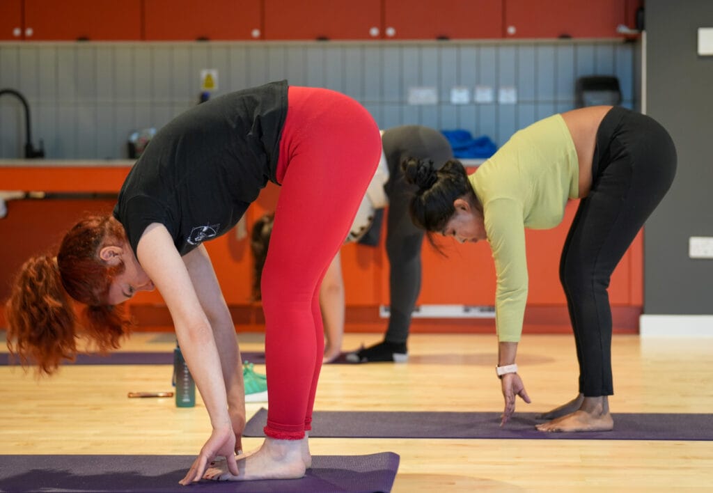 A photo of two girls doing yoga in the MOVE studio at Purdown View, UWE Bristol