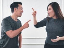 The Growing Challenge of Conflict in Student Accommodation man in gray crew neck long sleeve shirt standing beside woman in black crew neck shirt